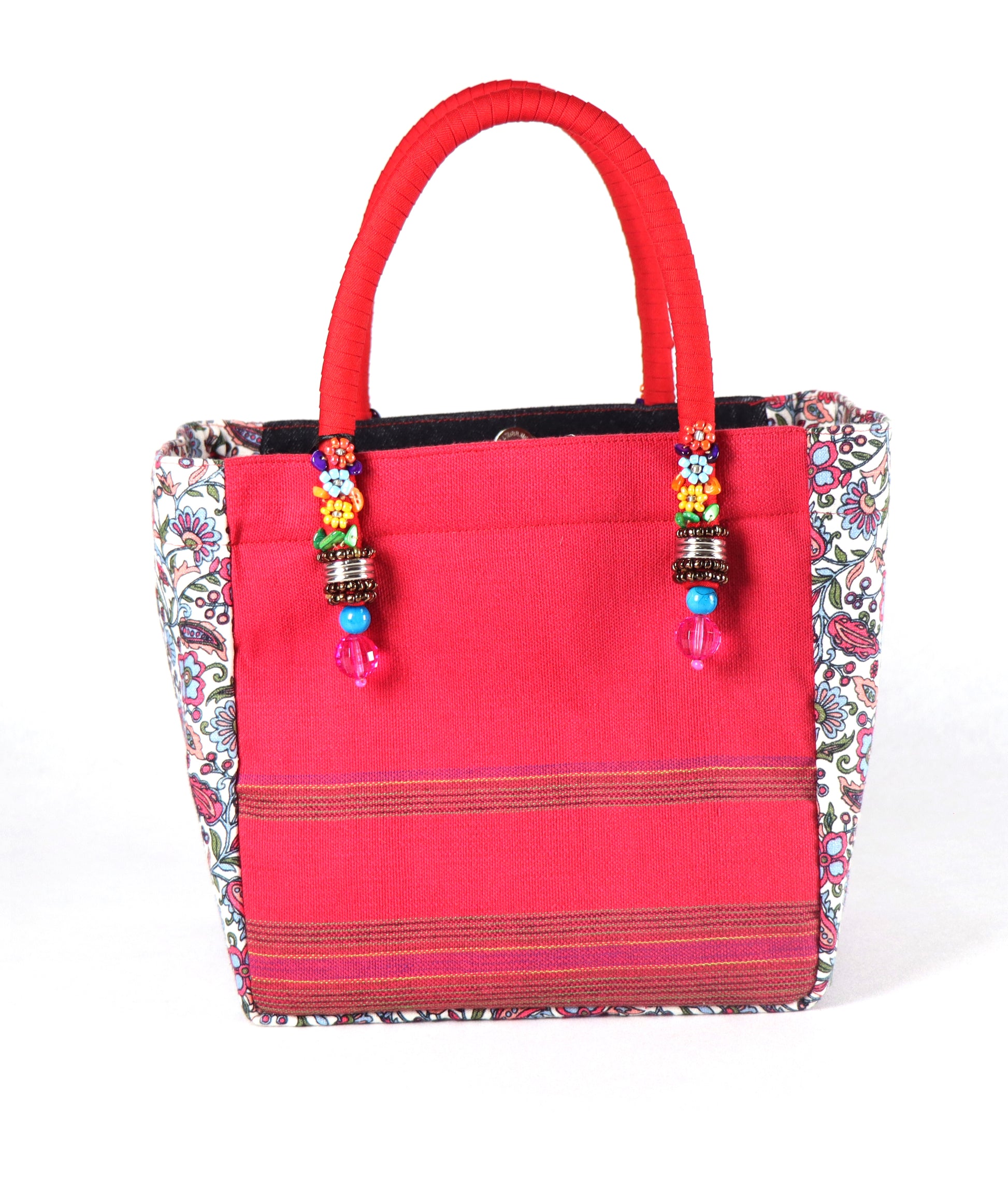 Comes in red handle, black denim body, and white & pink floral pattern on the side.