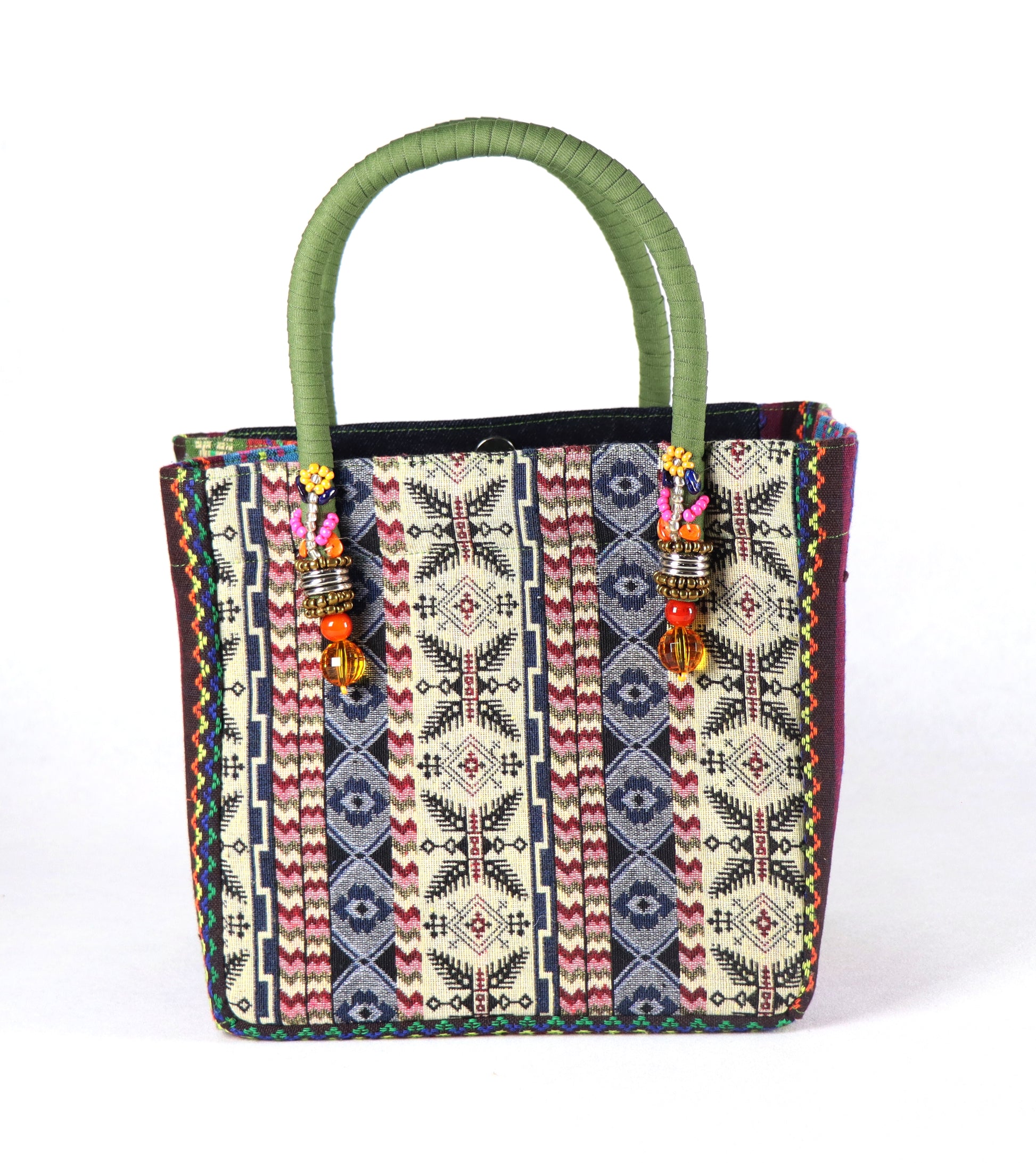 Comes in olive green handle, black denim with studs on the front, aztec pattern from the sides going to the back.