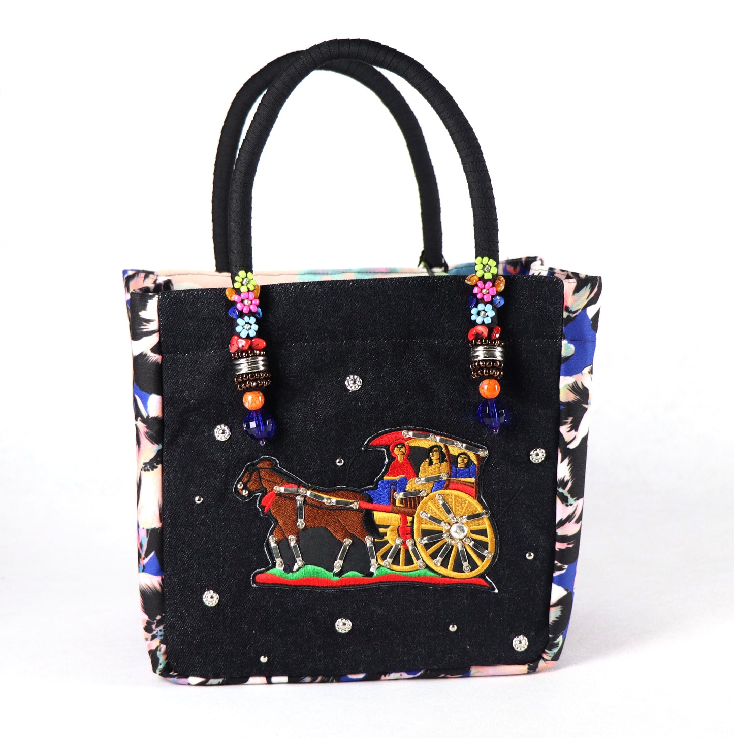 Comes in black handle, black denim with studs on the front, a flowery pattern on the sides, and a multi-colored dye design on the back.