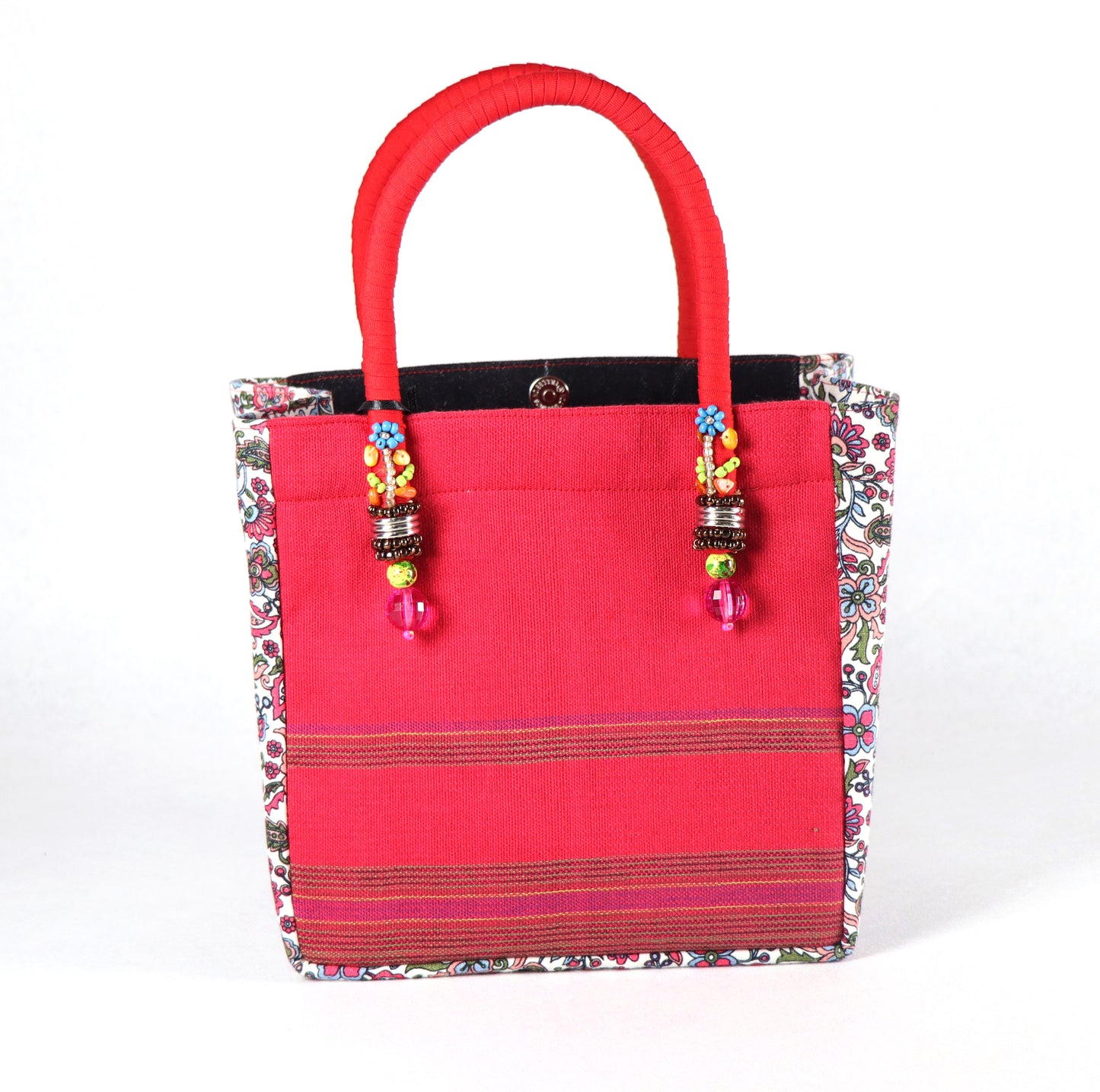 Comes in red handle, black denim with studs, a floral red pattern on the sides, and a plain red back.