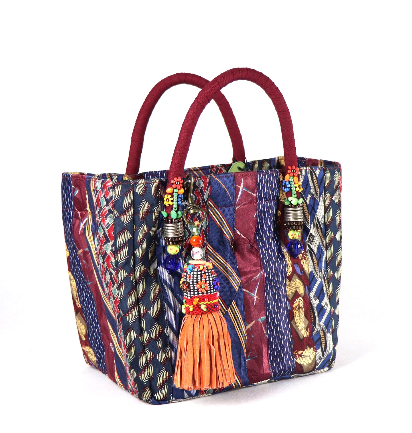 Goes in maroon handle, orange tassel, and a range of dark blue to red ties for the body.