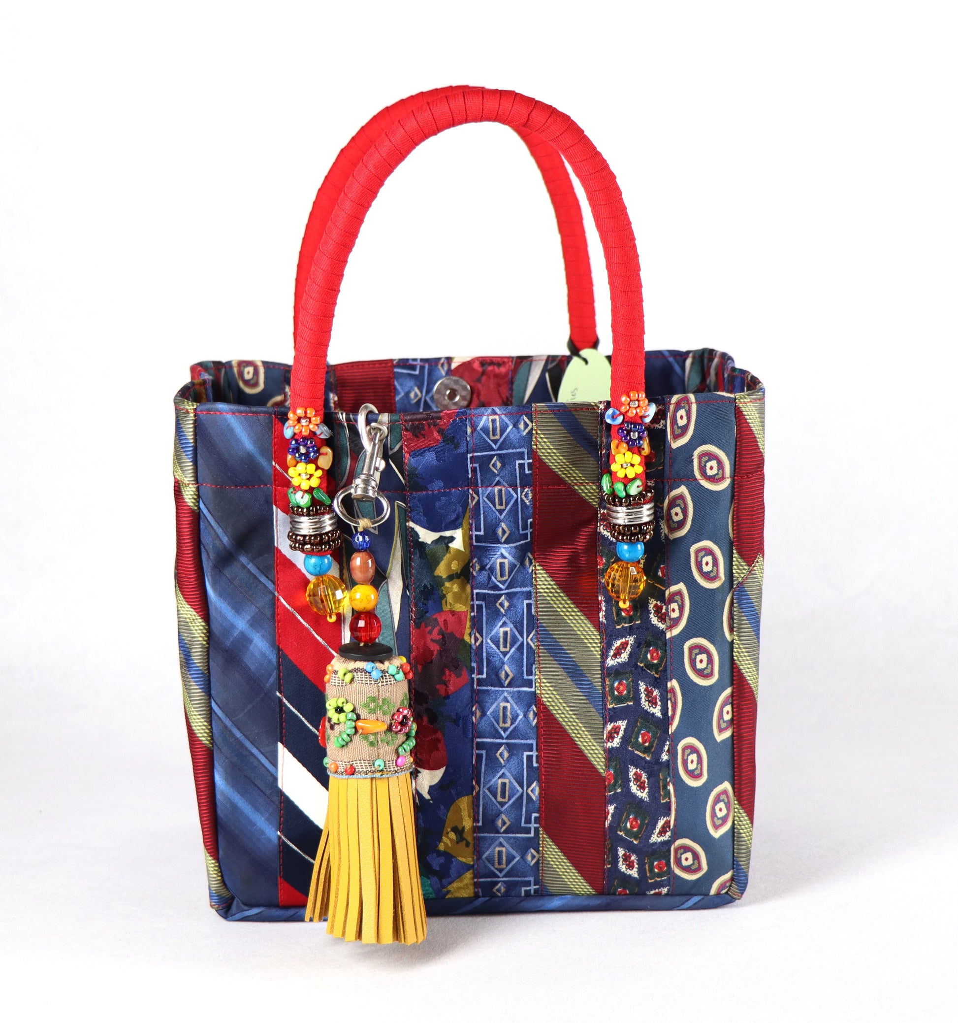 Goes in red handle, yellow tassel, and a range of blue to red ties for the body.