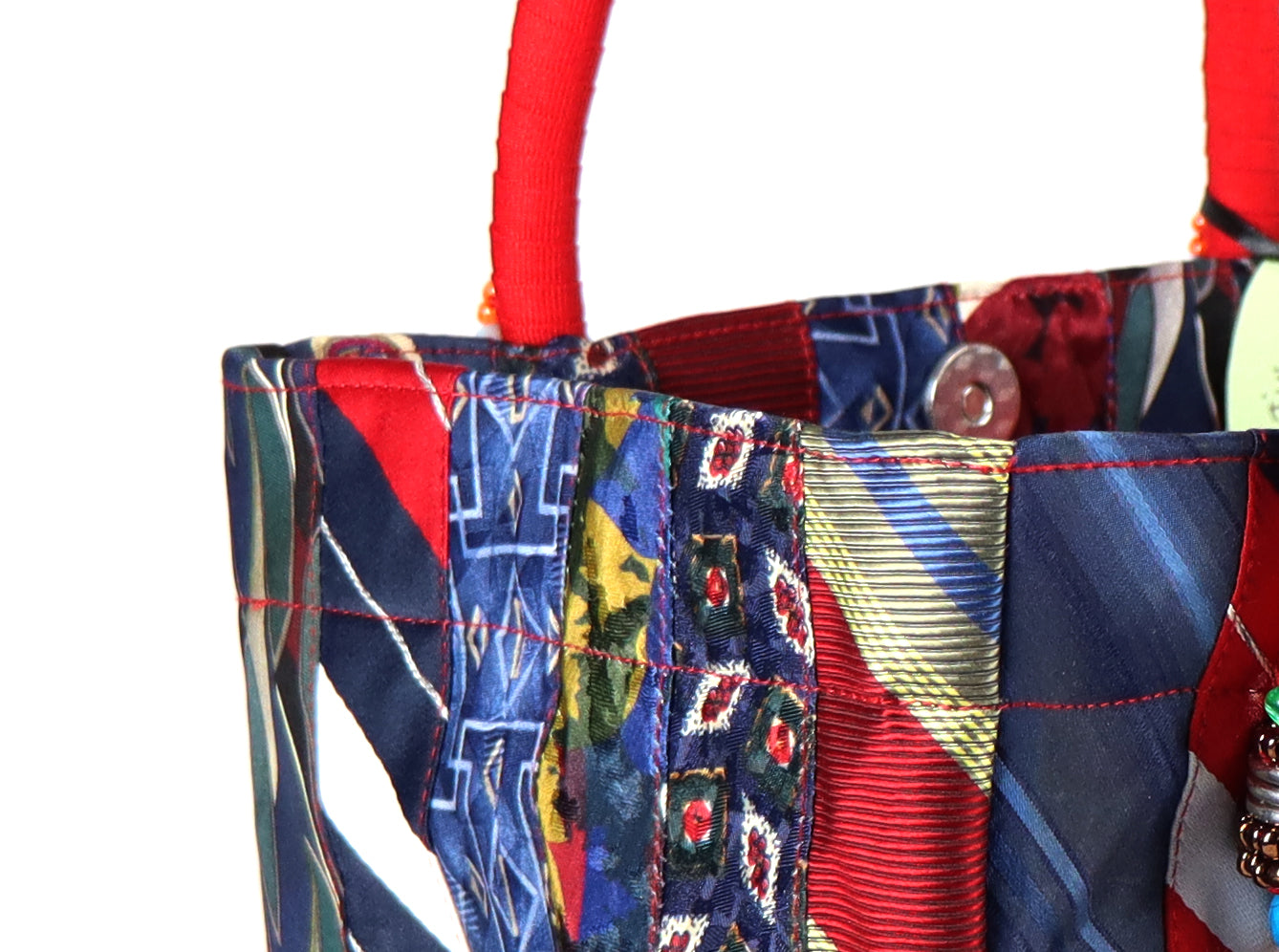 Goes in red handle, yellow tassel, and a range of blue to red ties for the body.