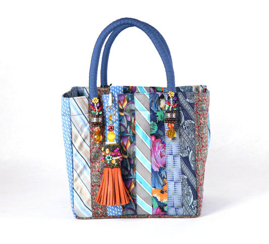 Goes in blue handle, orange tassel, and a range of light to dark blue ties for the body.