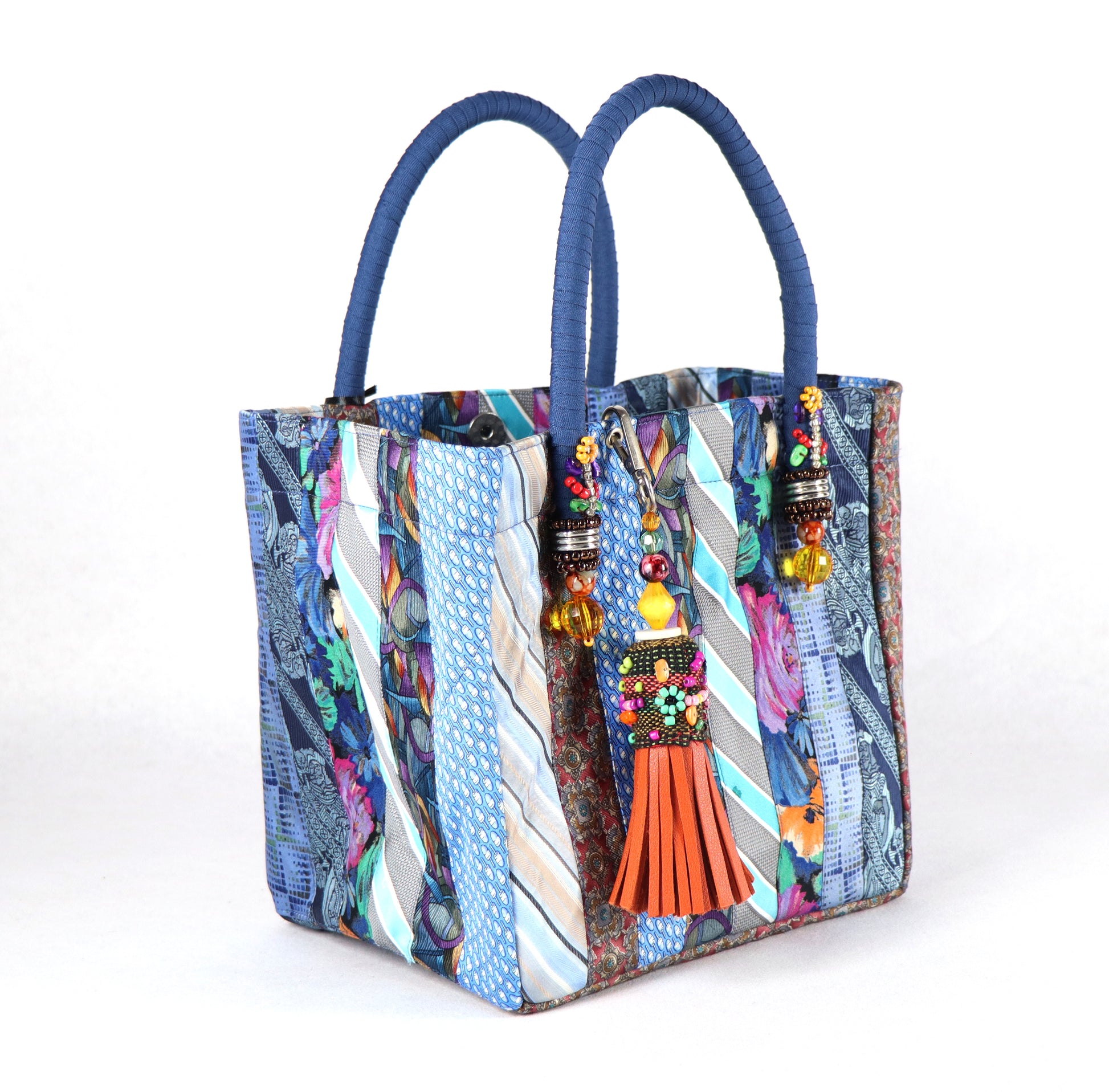 Goes in blue handle, orange tassel, and a range of light to dark blue ties for the body.