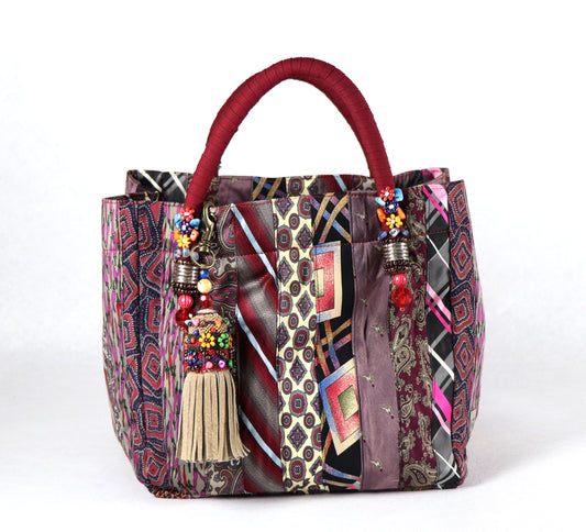 Goes in maroon handle, beige tassel, and a range of burgundy to light purple ties for the body.